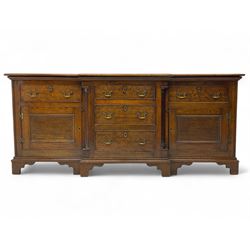 George III oak sideboard, rectangular top with stepped centre section and moulded edge, th...