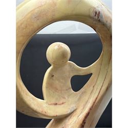 Abstract marble sculpture modelled as a mother and child on a rectangular base, H62cm