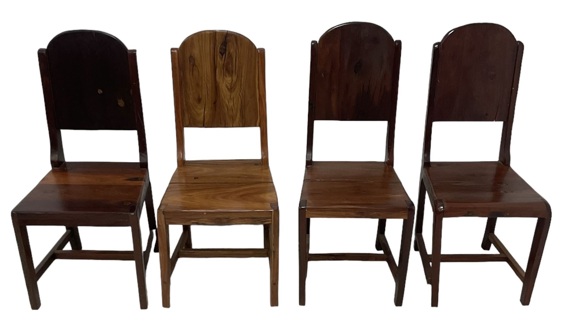 Mid-to-late 20th century teak dining table, rectangular top with canted corners, on square tapering supports with spade feet (214cm x 119cm, H76cm); and a set of eight Burmese reclaimed teak dining chairs, high arched back over panelled seat