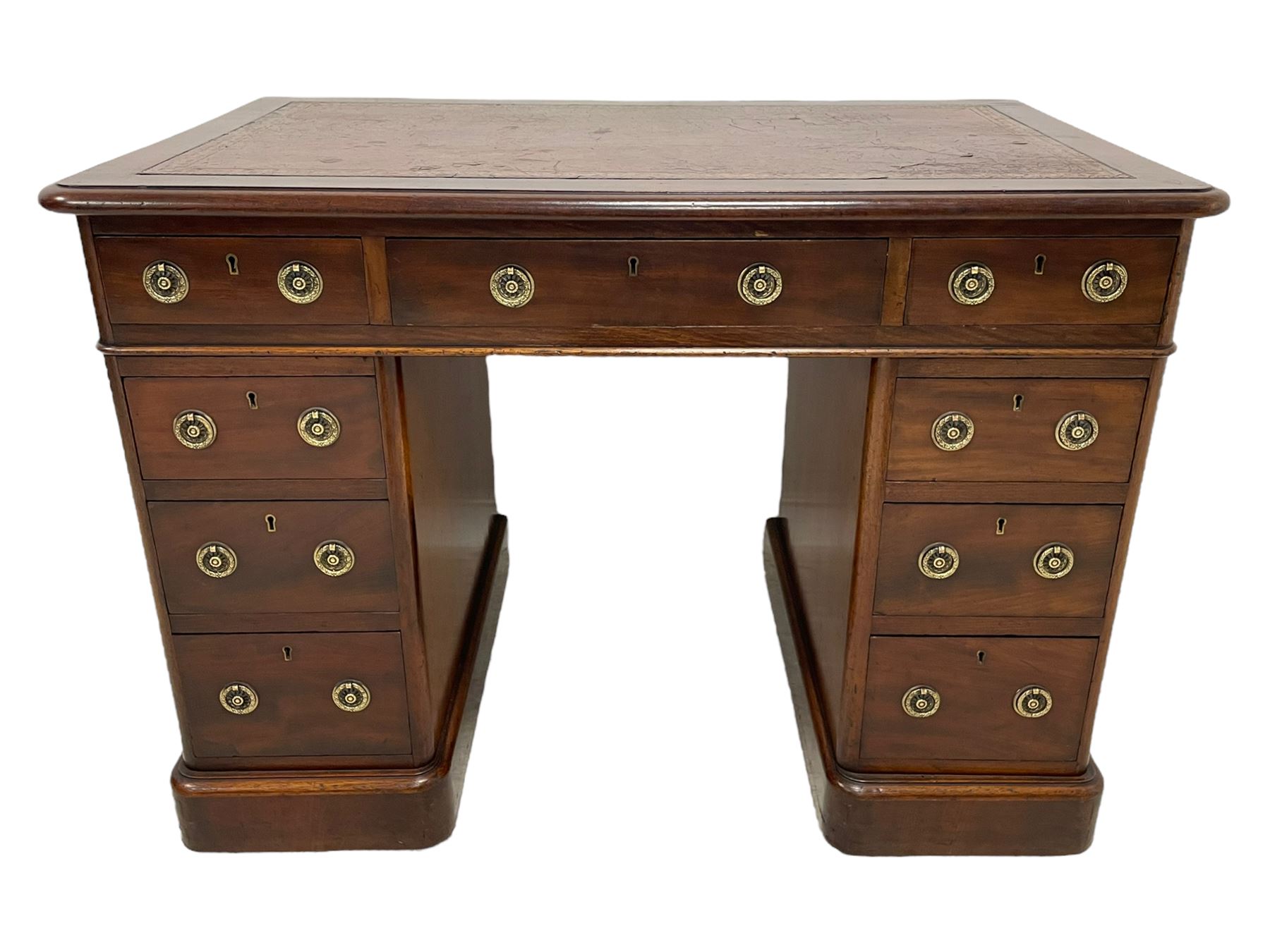 Victorian mahogany twin pedestal desk, moulded rectangular top with rounded corners and inset leather writing surface, fitted with nine drawers, on moulded plinth base