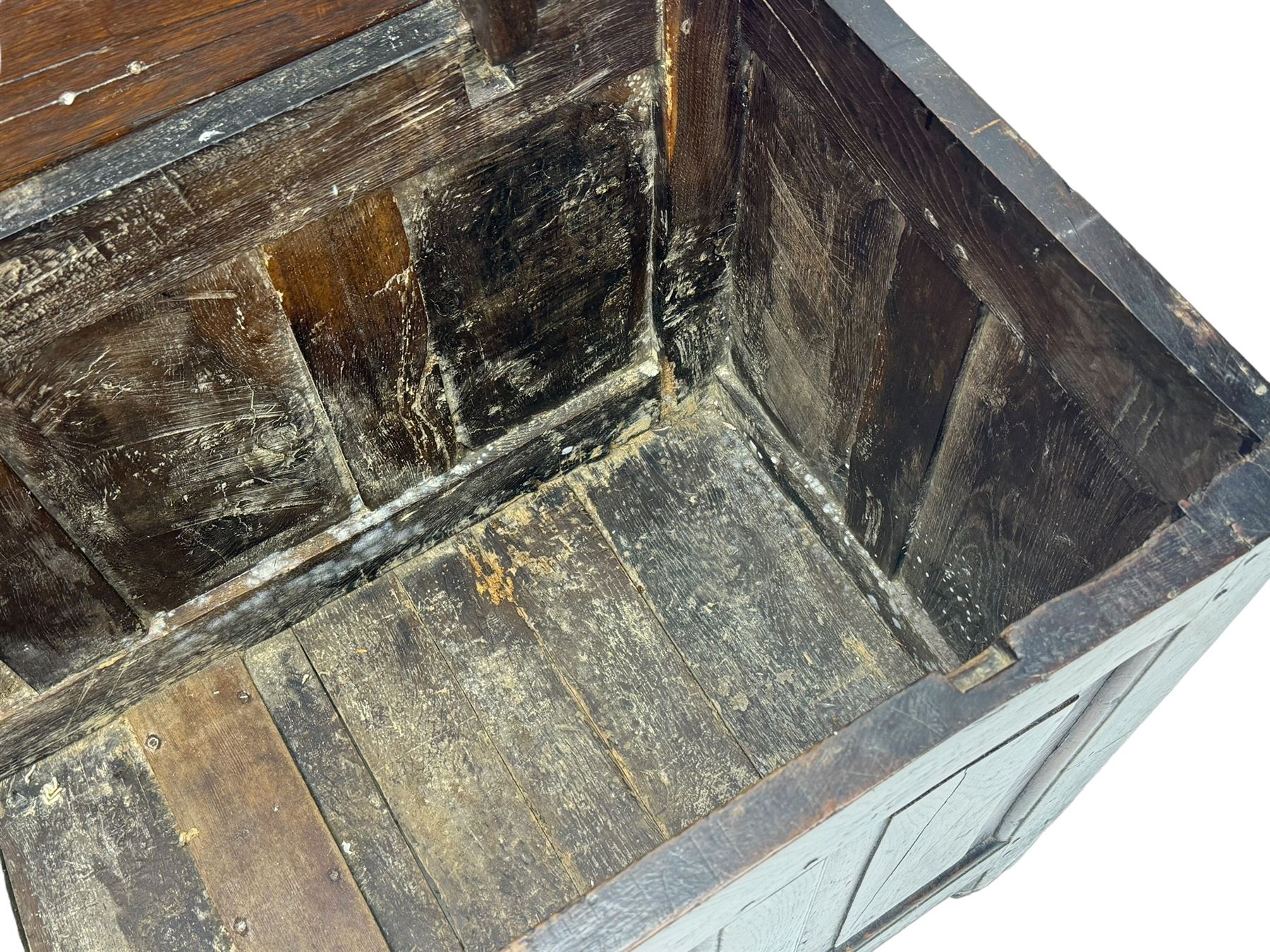 18th century oak coffer, rectangular plank lid over four panelled front and panelled sides, on stile supports 