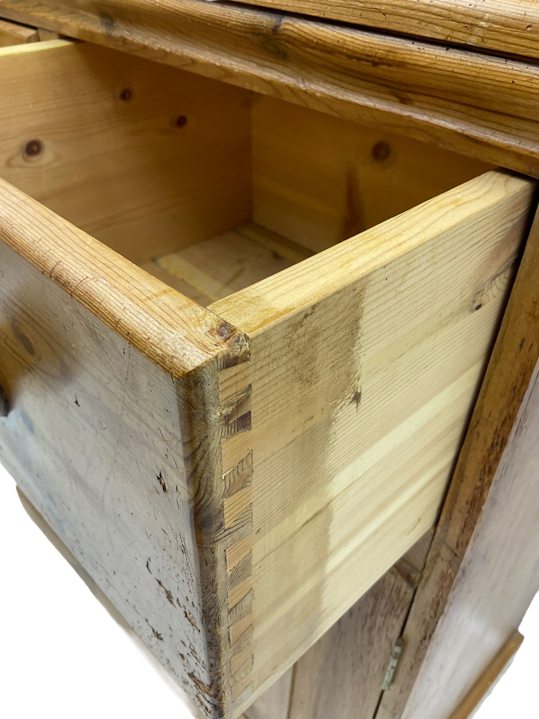 Solid pine dresser, fitted with plate rack above two drawers and two cupboards