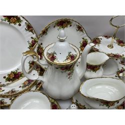 Royal Albert Old Country Roses pattern coffee service for six, comprising coffee pot, milk jug, cups and saucers, cake plate, together with miniature teapot, six teacups and saucers, six dinner plates, six side plates etc 