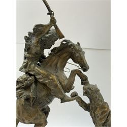 After Charles Marion Russell; Bronzed sculpture depicting man on horseback fighting a mountain lion, H42cm