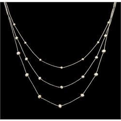 18ct white gold three strand bead necklace, stamped 750