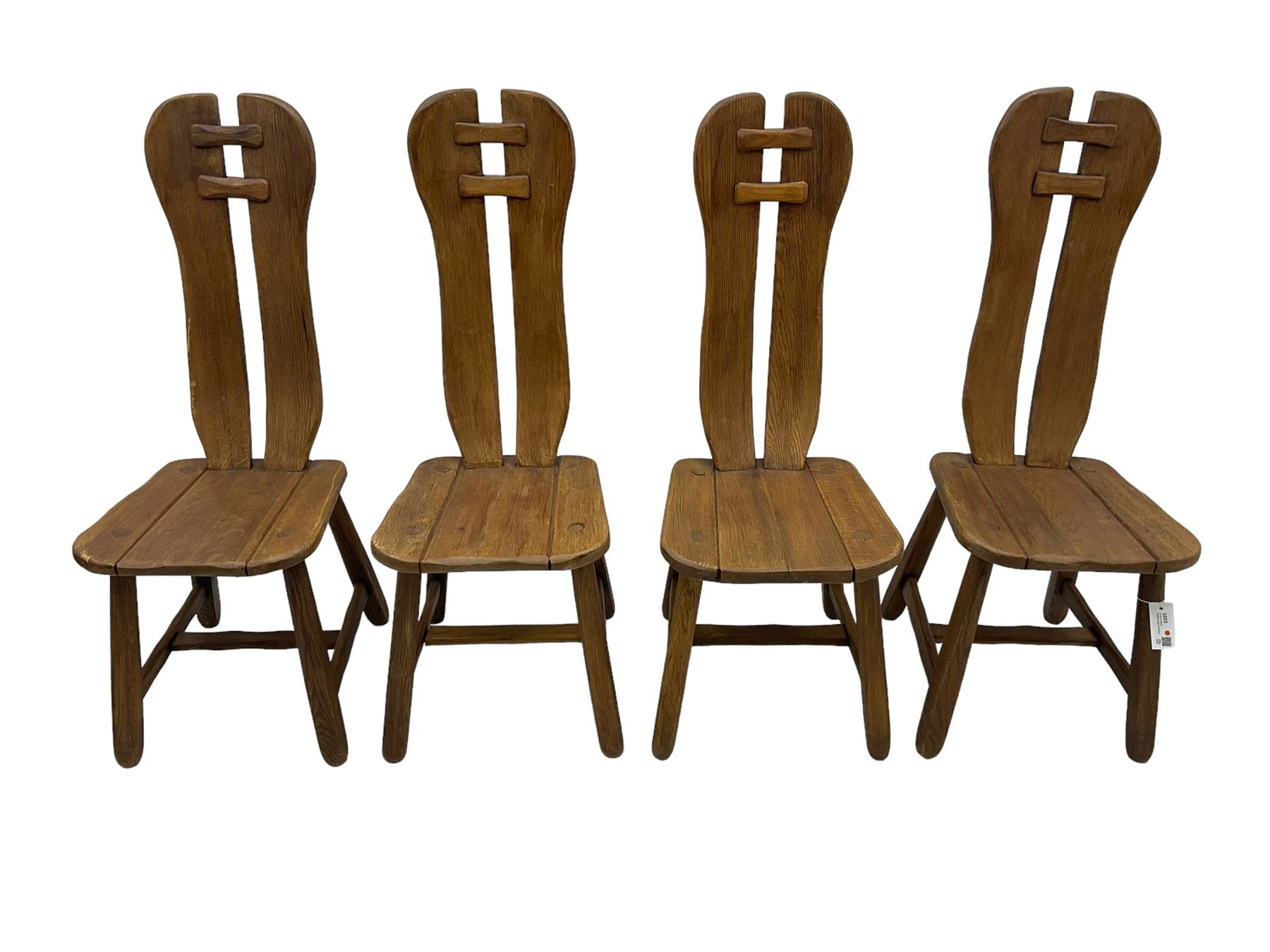 Attributed to De Puydt - set of four mid-century Brutalist oak dining chairs, twin slat back united by pegs, on square tapering supports united by H-stretcher 