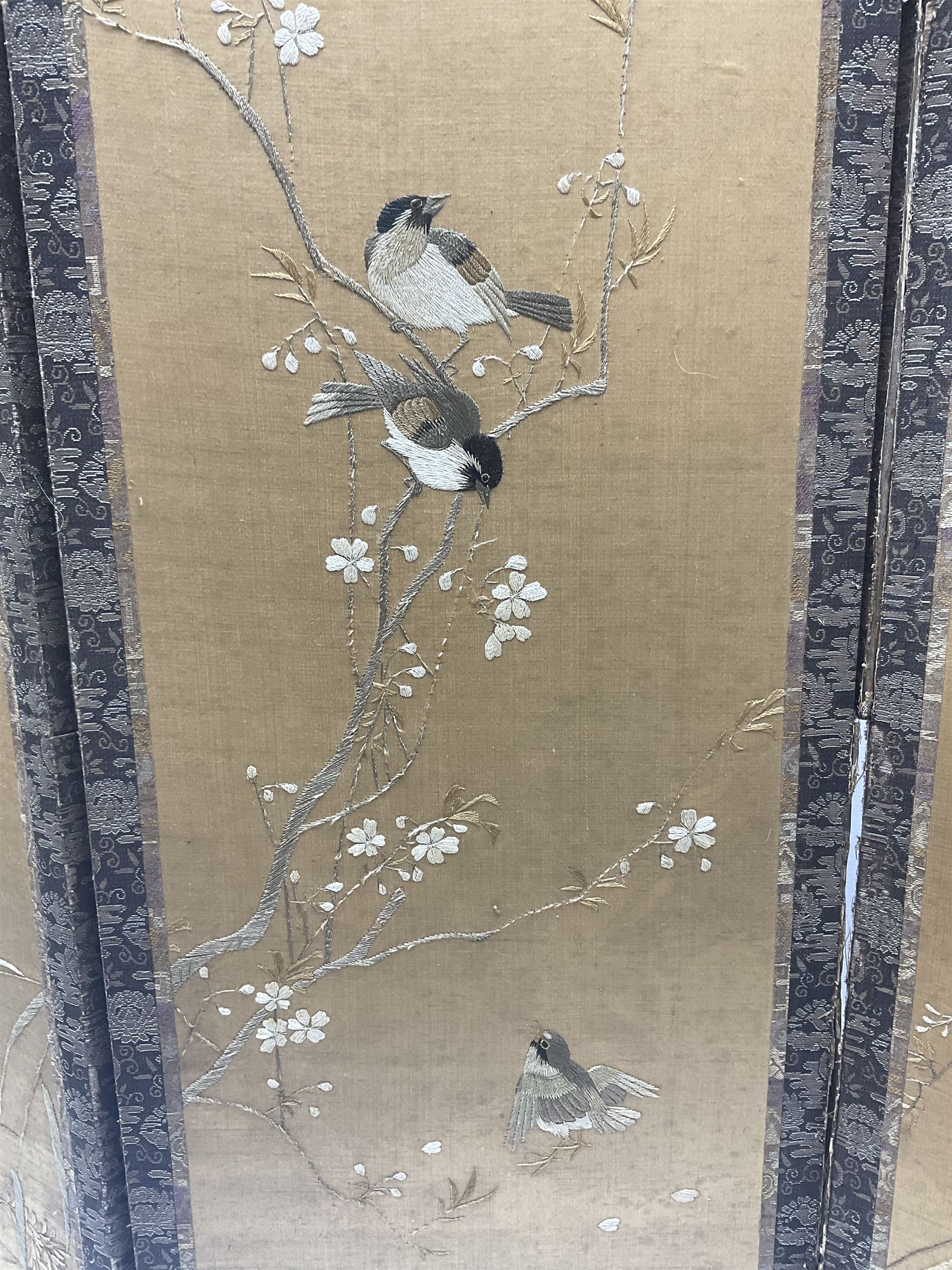 Two Oriental silk and wooden screens embroidered with birds and blossoming branches, largest H88cm 