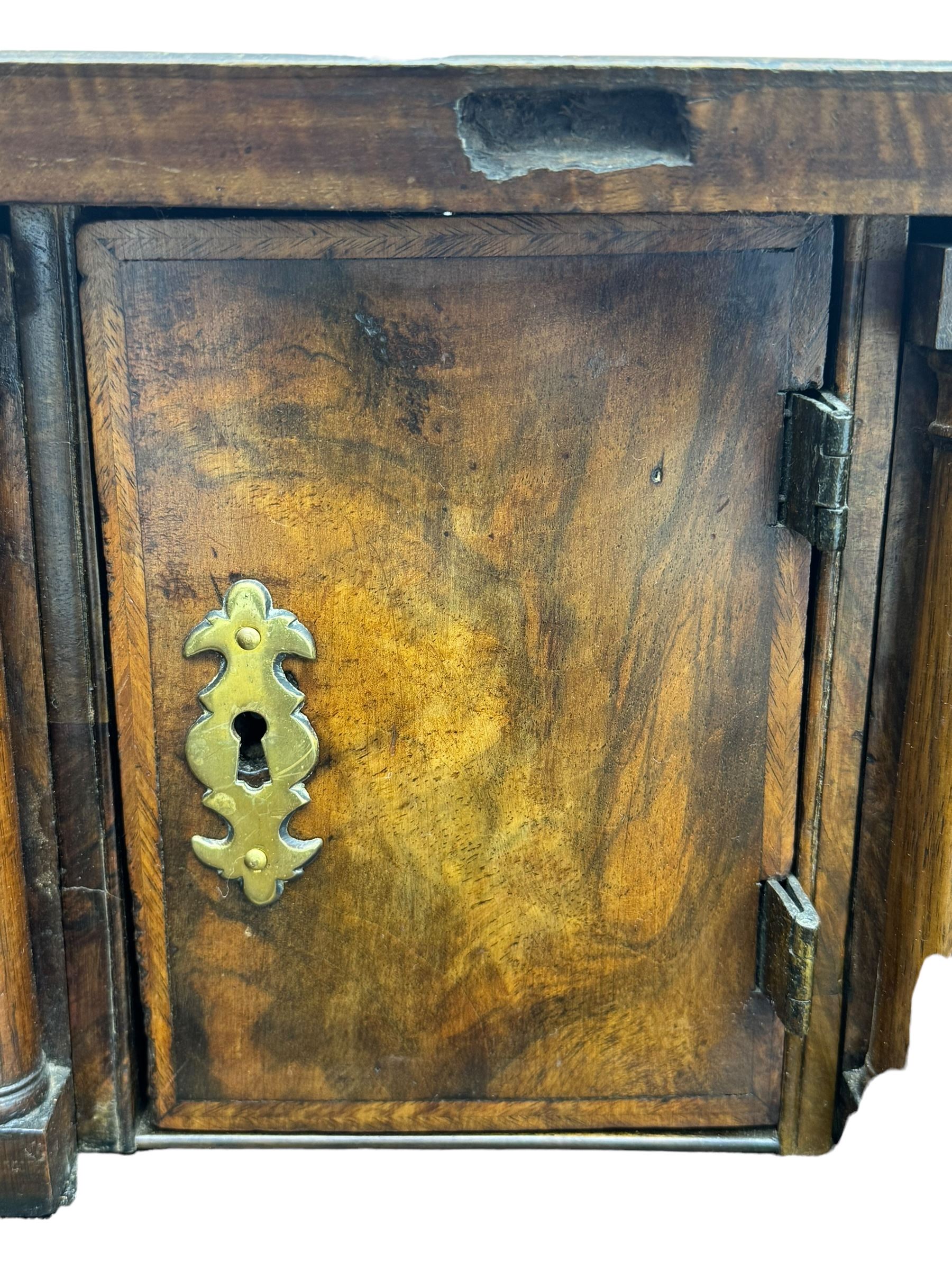 18th century walnut bureau, fall-front enclosing fitted interior with drawers and pigeonholes, over two short and two long drawers with brass escutcheon plates and handles, raised on bracket feet