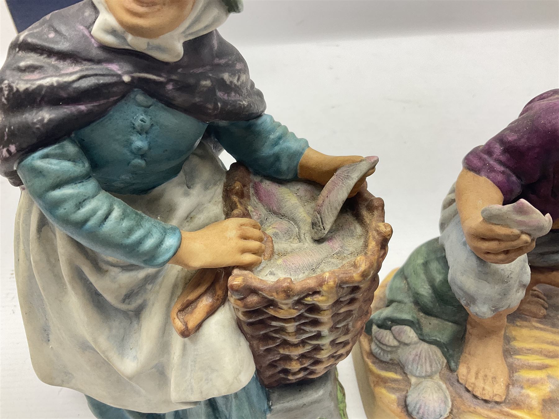 Five Royal Doulton figures, comprising The Milkmaid HN2057, New Baby HN 3713, With Love HN3393, Old Meg HN2494 and Beachcomber HN2487