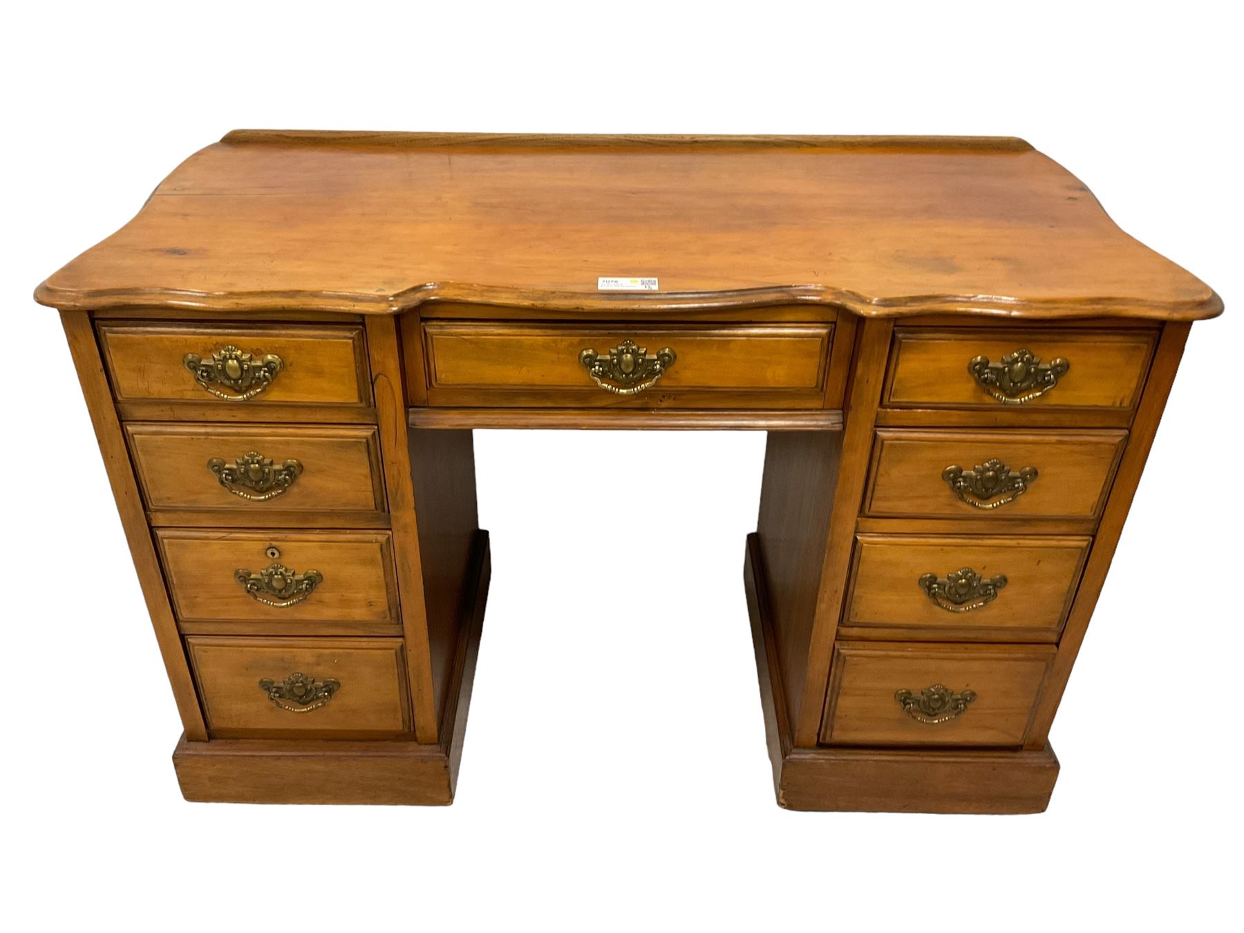 Late 19th century walnut twin pedestal desk, shaped moulded top over nine drawers, on moulded plinth base 