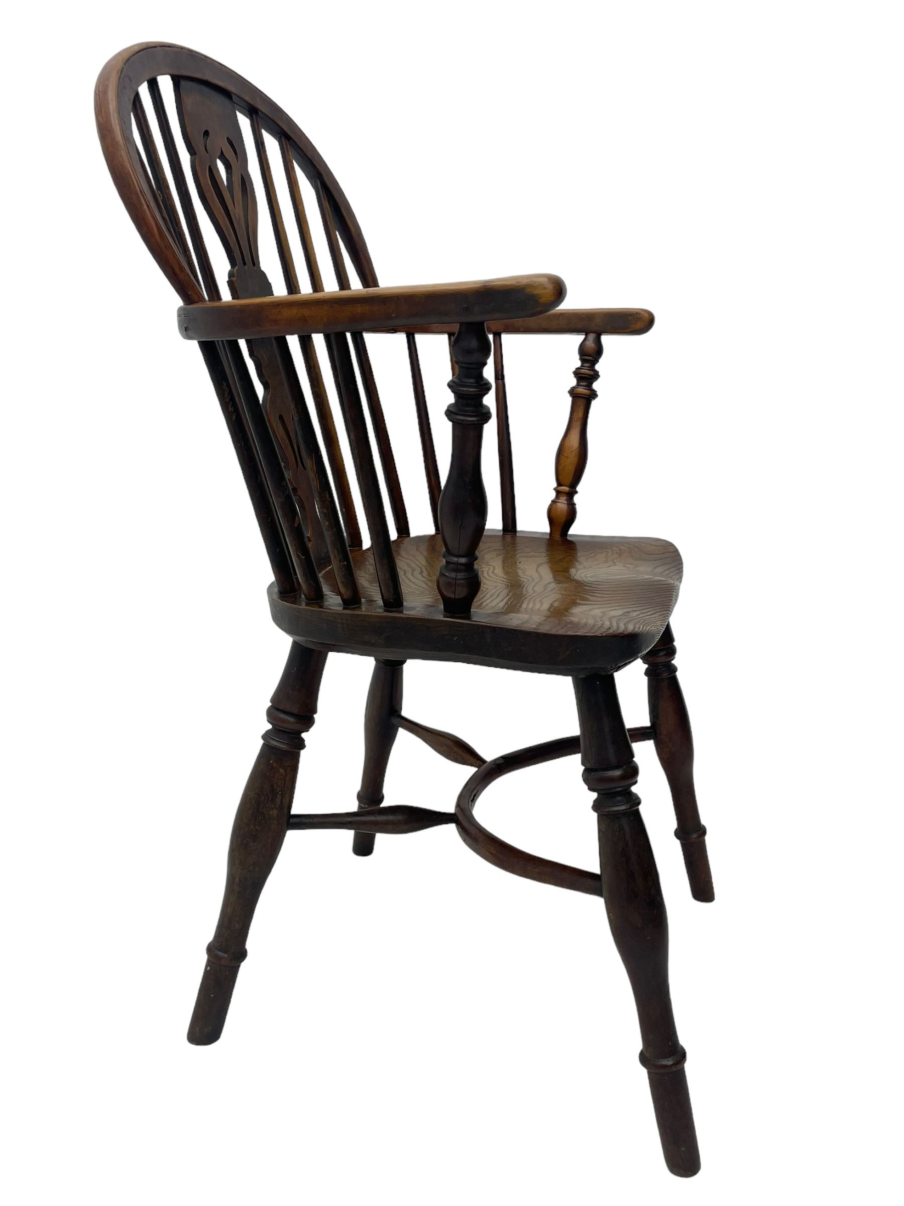 19th century yew wood and elm Windsor armchair, low double hoop stick and pierced splat back, dished seat on turned supports united by crinoline stretchers