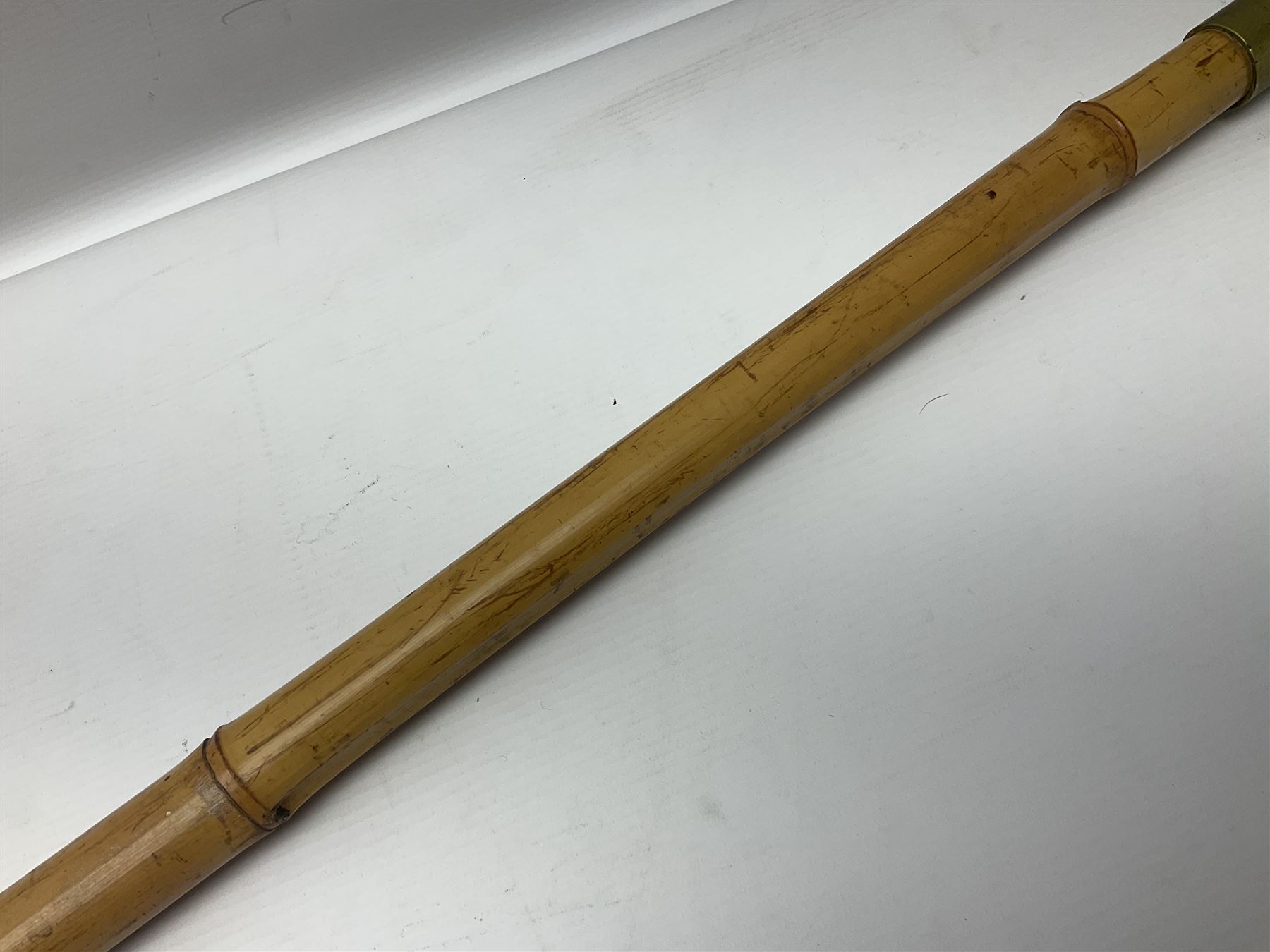 Bamboo cane torch, the pierced brass cover opening to reveal a wick, H144cm