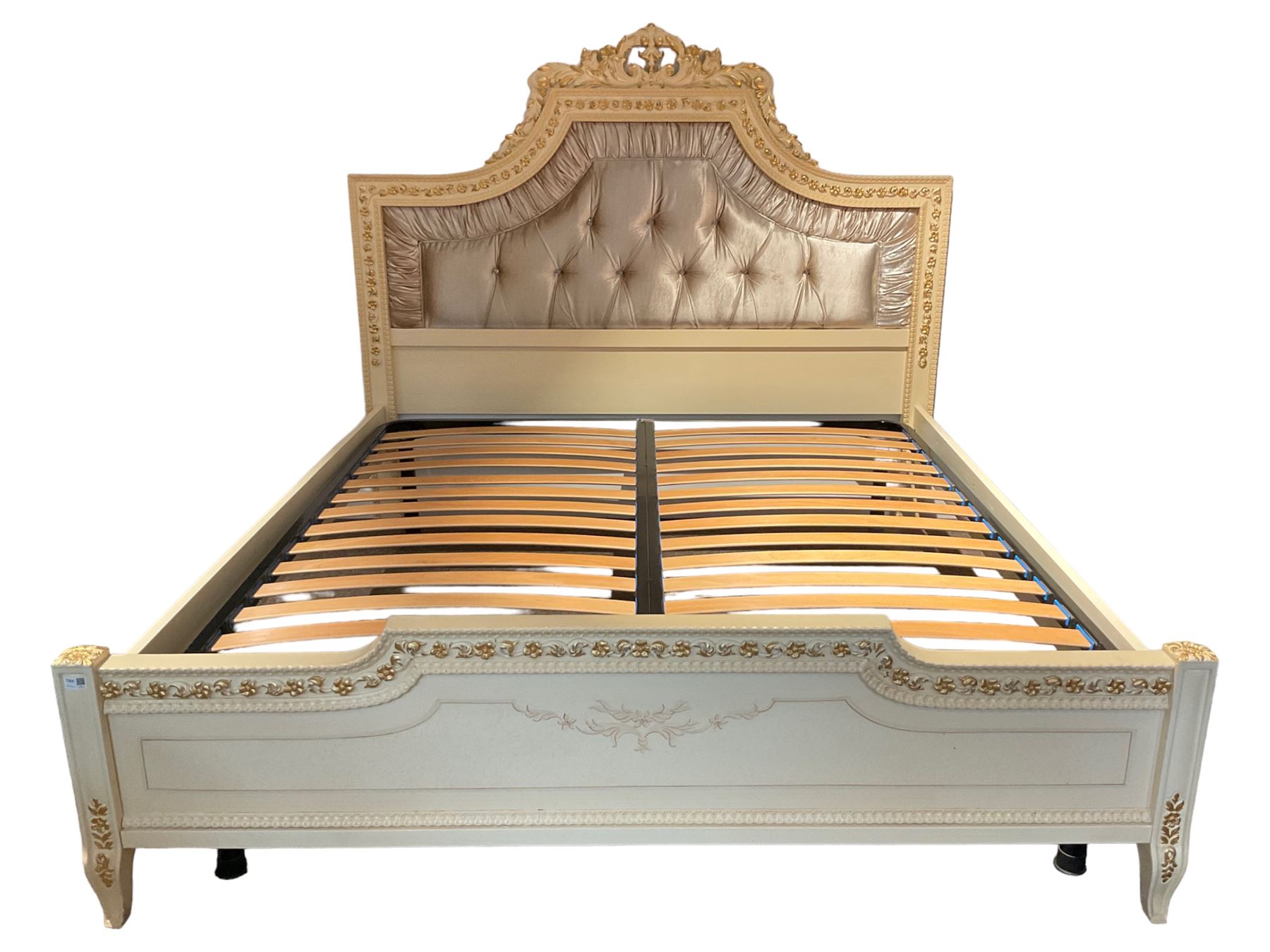 Barnini Oseo - super king 6' 'Reggenza' bedstead, the headboard with a pierced cartouche pediment with extending scrolling foliage, decorated with trailing gilt flower heads, upholstered in buttoned lilac velvet, raised on cabriole feet, in a cream finish