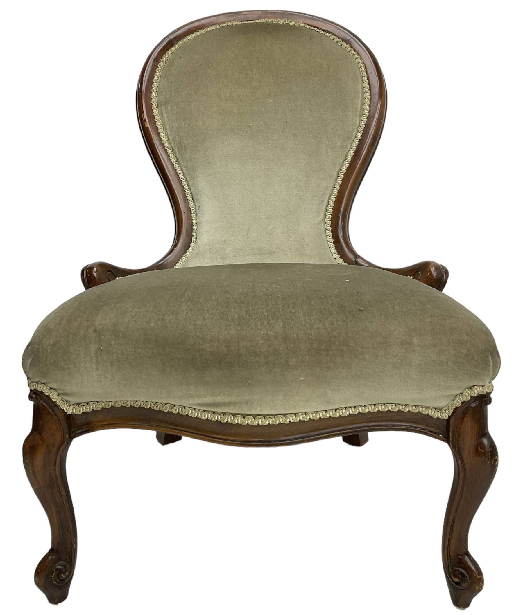 Victorian design nursing chair, moulded spoon back upholstered in green fabric, on scroll carved cabriole feet