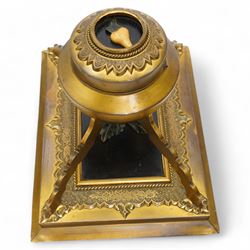 19th century gilt brass inkstand, of circular form, the hinged cover decorated with hardstone fruit and foliage upon a black ground, opening to reveal ink recess, upon four raised feet with a stepped square base, decorated with engraved foliate boarder, the black central panel with similar hardstone decoration H16cm; together with a pair of Chevalier of Paris opera glasses and a cast metal sculpture of a hunting dog (3)