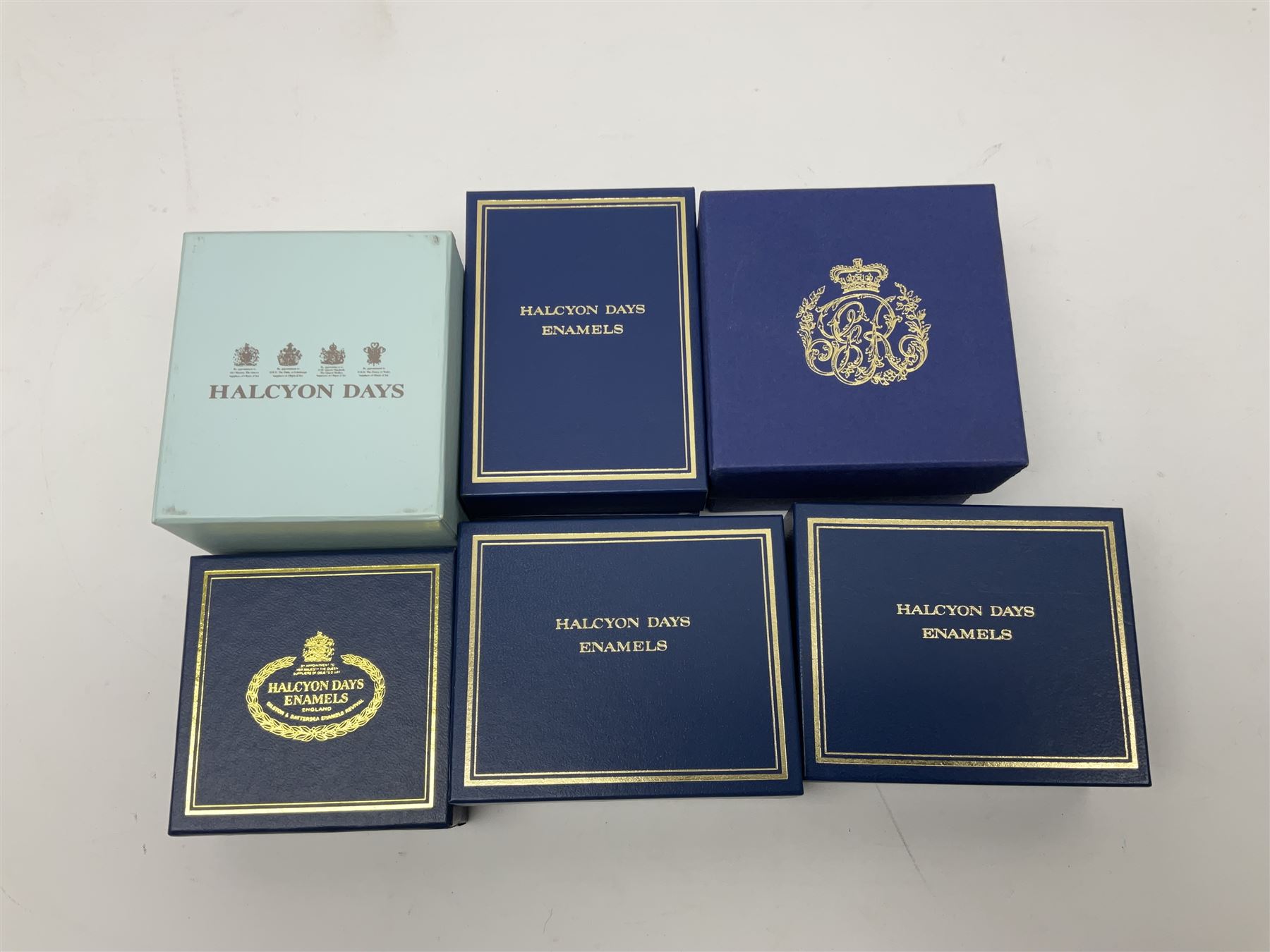 Five Halcyon Days Royal commemorative enamel boxes and one other similar enamel box, including two gilt examples depicting the Queen and Prince Philip in profile, to commemorate their 80th ad 85th birthdays respectively, all boxed, largest D6.5cm