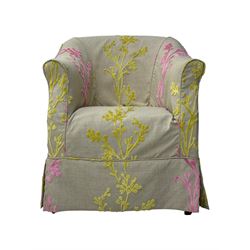 Pair of tub-shaped armchairs, mahogany frame loosely covered by branching floral pattern cover in pink and  yellow hues, skirted base, on concealed splayed rear and tapered front supports