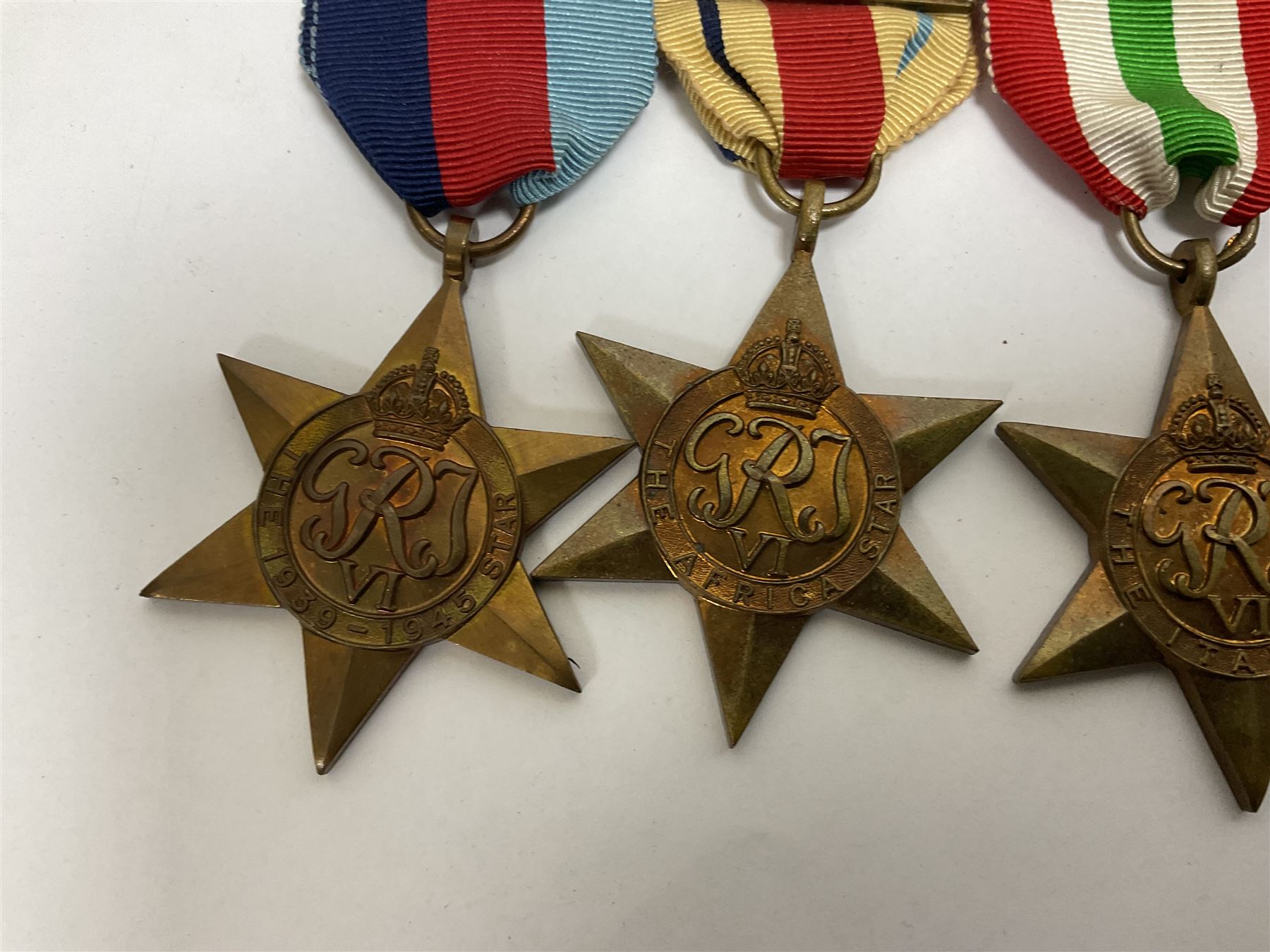 WWII group of six medals comprising 1939-45 Star, The Africa Star, The Italy Star, France and Germany Star, Defence Medal and War Medal 1939-45, awarded to 7899181 RAC C.W Hughes, together with two chevrons and ephemera relating to Charles William 'Bill' Hughes including Soldier's Release Book, photographs, certificates of transfers etc 