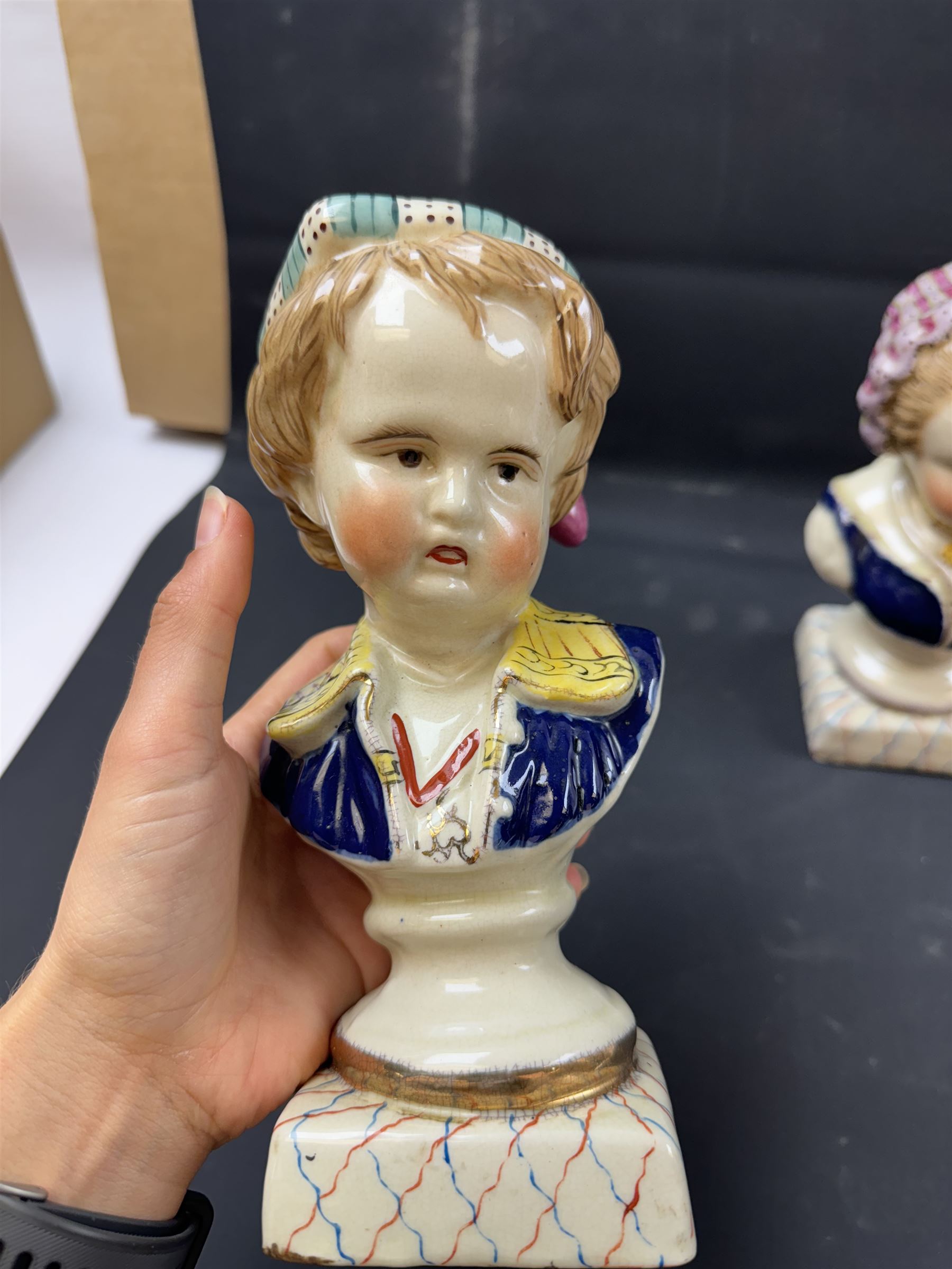 Pair or 20th century continental Bourbon children busts, together with another similar, H23cm