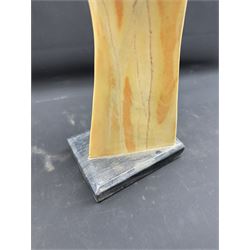 Abstract marble sculpture modelled as a dancer, upon a rectangular base, H58cm