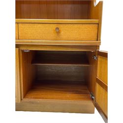 Nathan - teak wall unit, fitted with raised display cabinet and fall front compartment, three drawers and three cupboards below