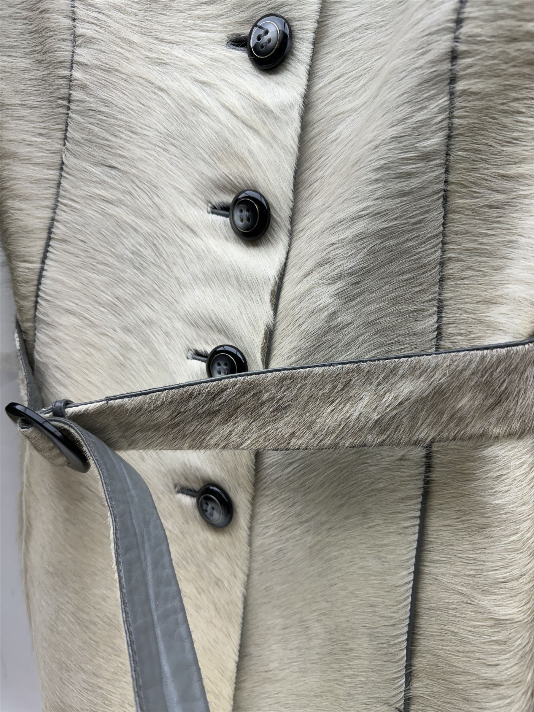 White pony hide, with grey leather sleeves and silk liner