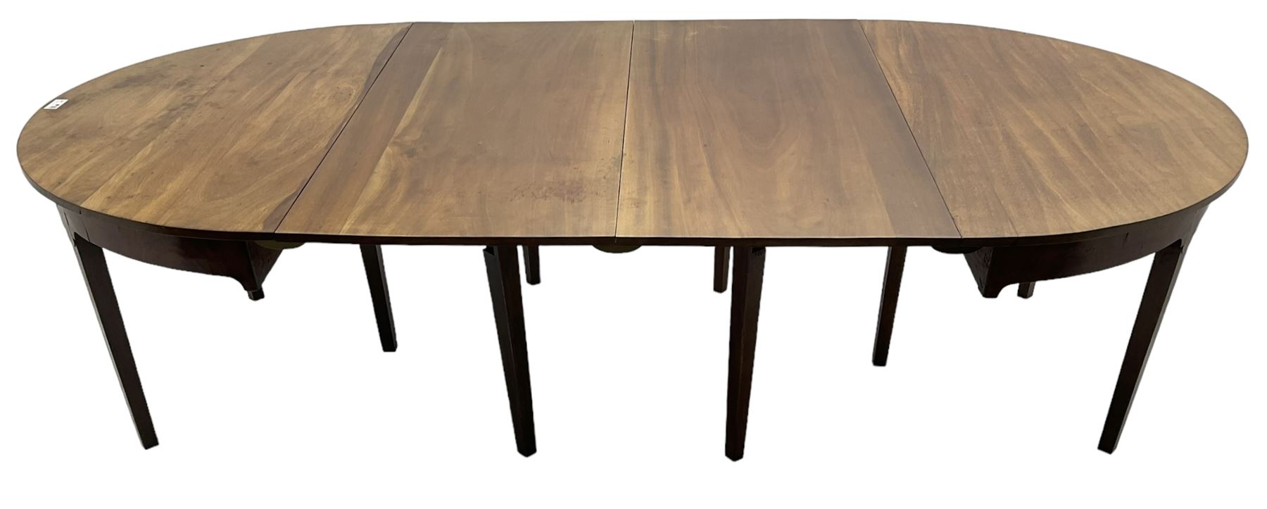 George III mahogany extending dining table, two D-ends with two leaves, on square tapering supports