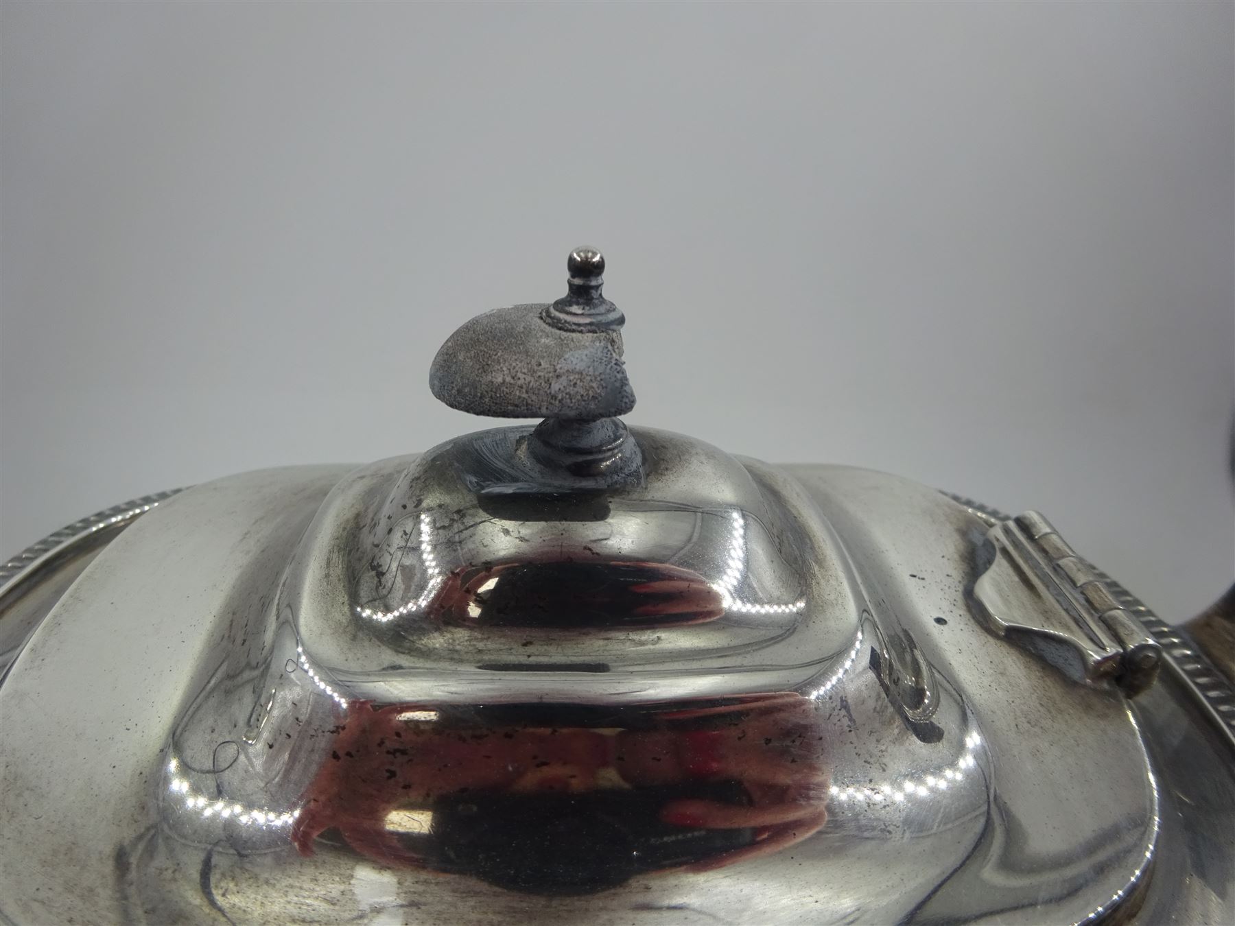 1930s silver three piece tea service, comprising teapot, open sucrier and milk jug, each of oval form with oblique gadrooned rim, the teapot with Bakelite handle and finial, hallmarked James Dixon & Sons Ltd, Sheffield 1932