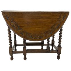 Early 20th century oak dining table, moulded oval drop-leaf top carved with lunettes, gate-leg action base, on spiral turned supports