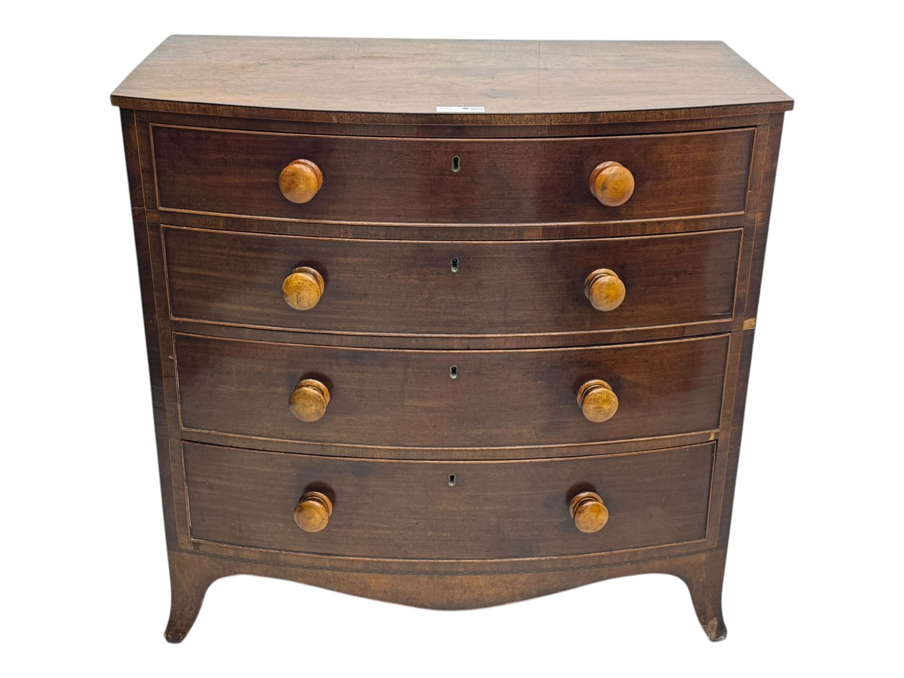 Victorian mahogany bow-fronted chest, fitted with four long graduating cock-beaded drawers, shaped apron on splayed bracket feet