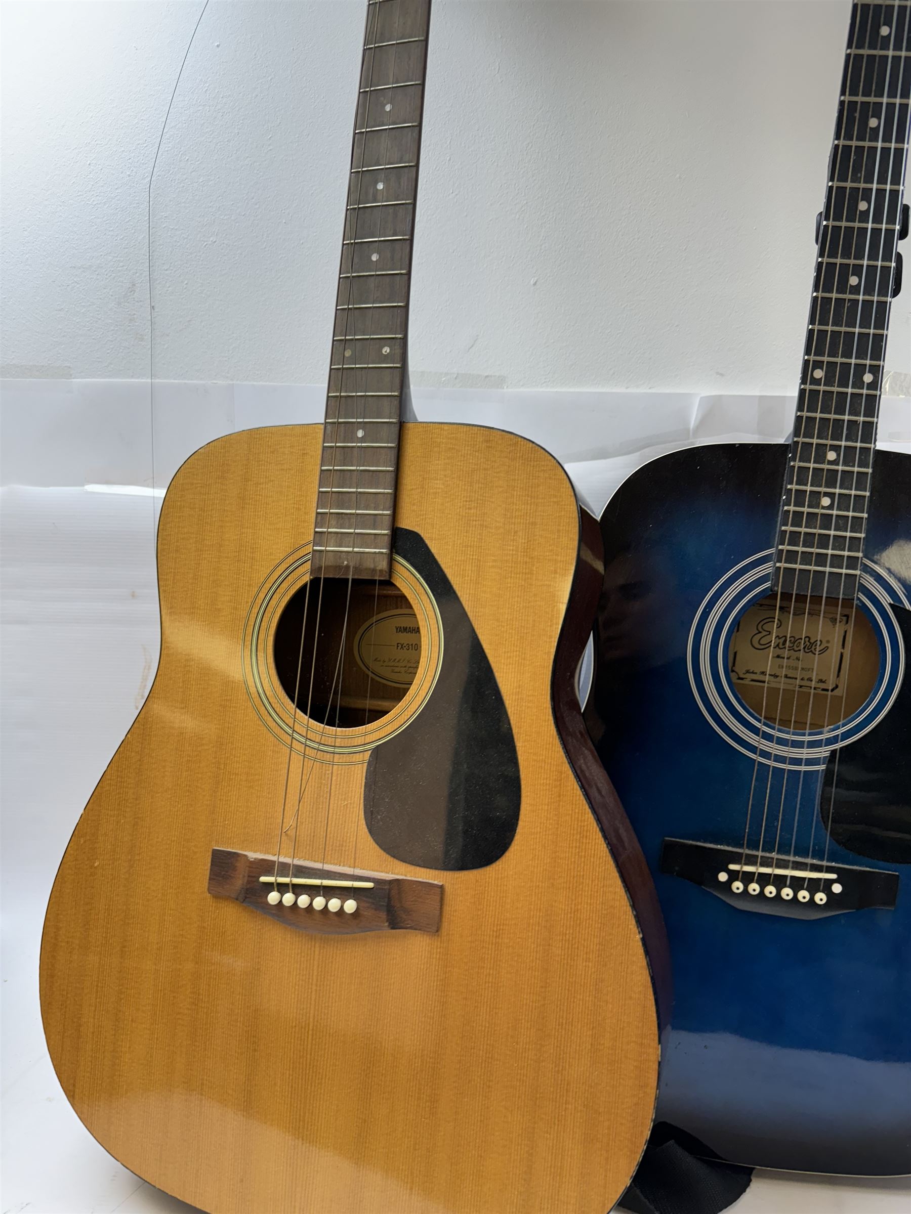 Three acoustic guitars, comprising Yamaha FX-310, Hohner MW-300 and Encore EN155BLMOFT