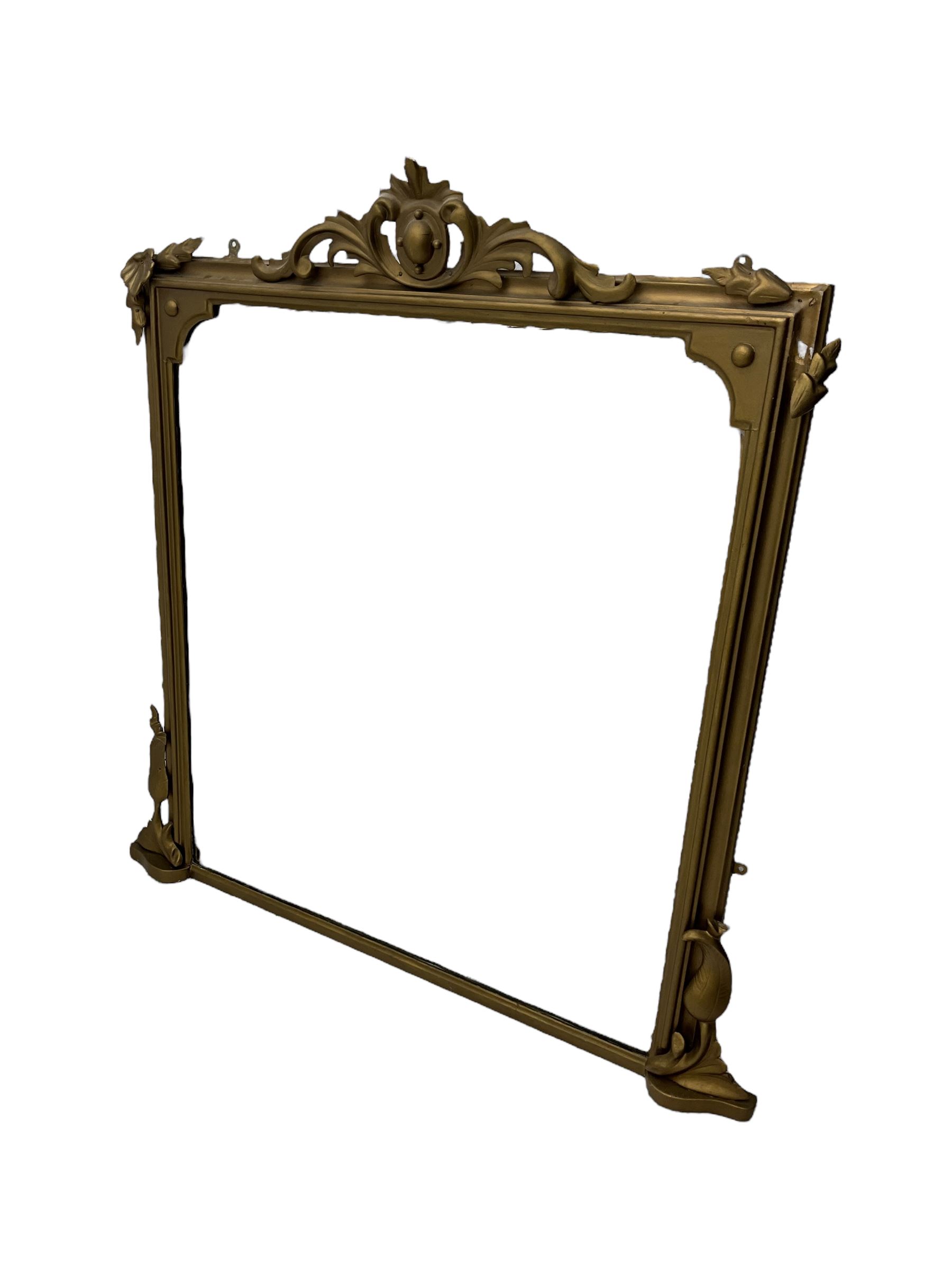 19th century gilt framed overmantel mirror, cartouche pediment surrounded by curling leaves, moulded framed enclosing plain mirror plate, decorated with applied trailing foliage motifs 