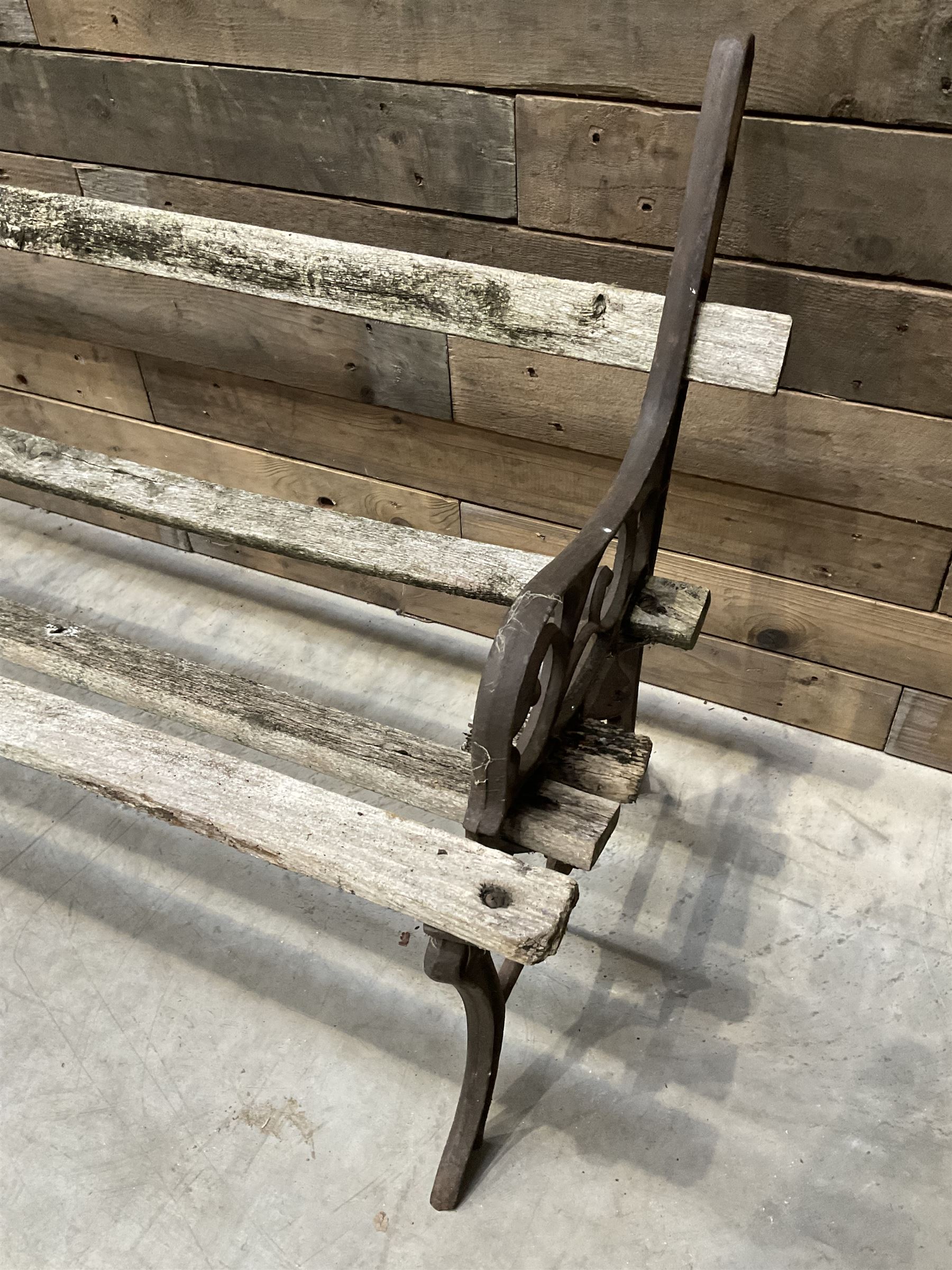 Pair of faux bois cast metal bench ends; together with wooden slatted bench with metal ends