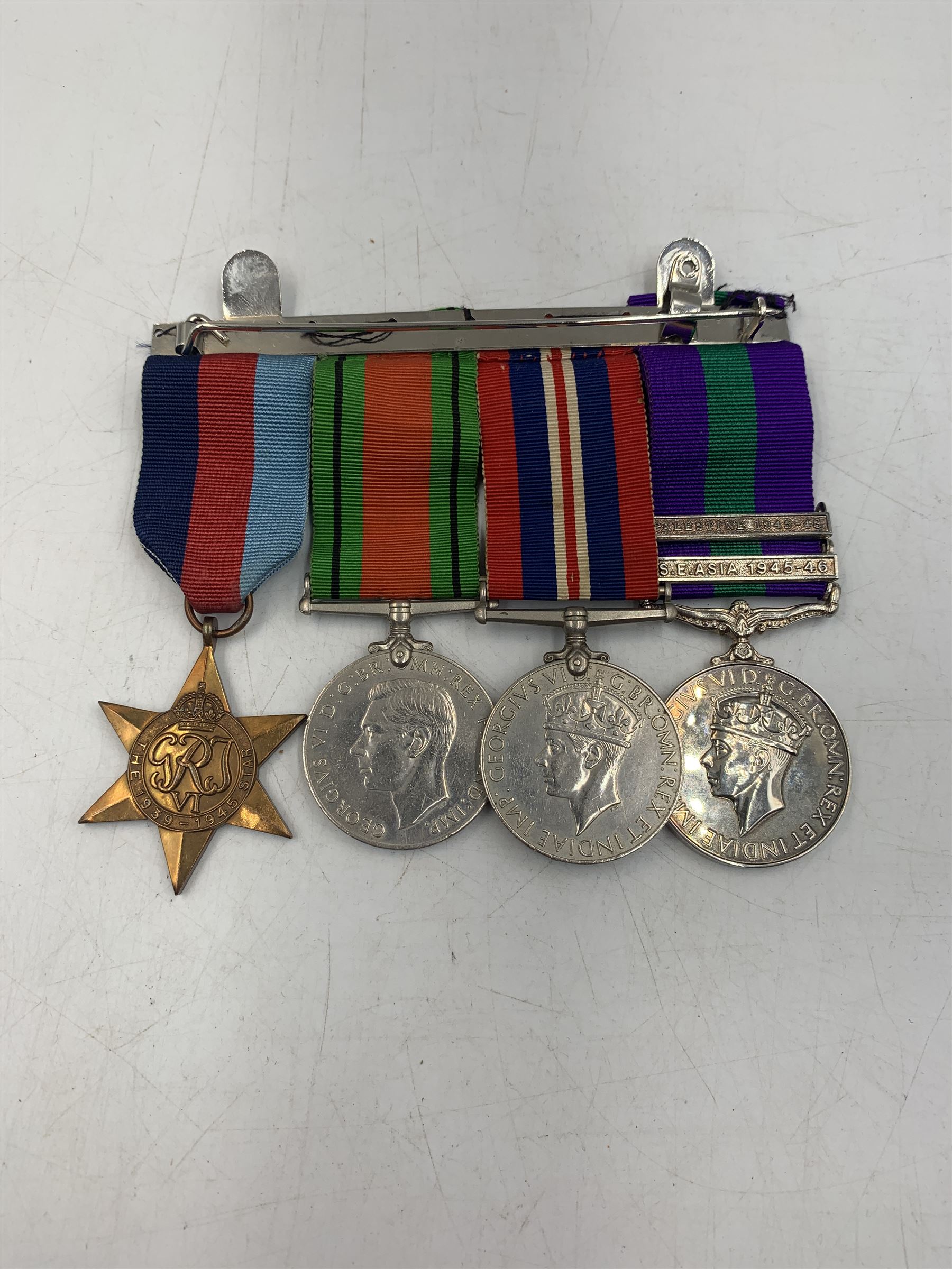 1939-1945 Star, 1939-1945 Defence Medal, 1939-1945 War Medal, Copy General Service Medal with Palestine 1945-48 and S.E Asia 1945-46 bars and a Copy South Atlantic Medal, with ribbons