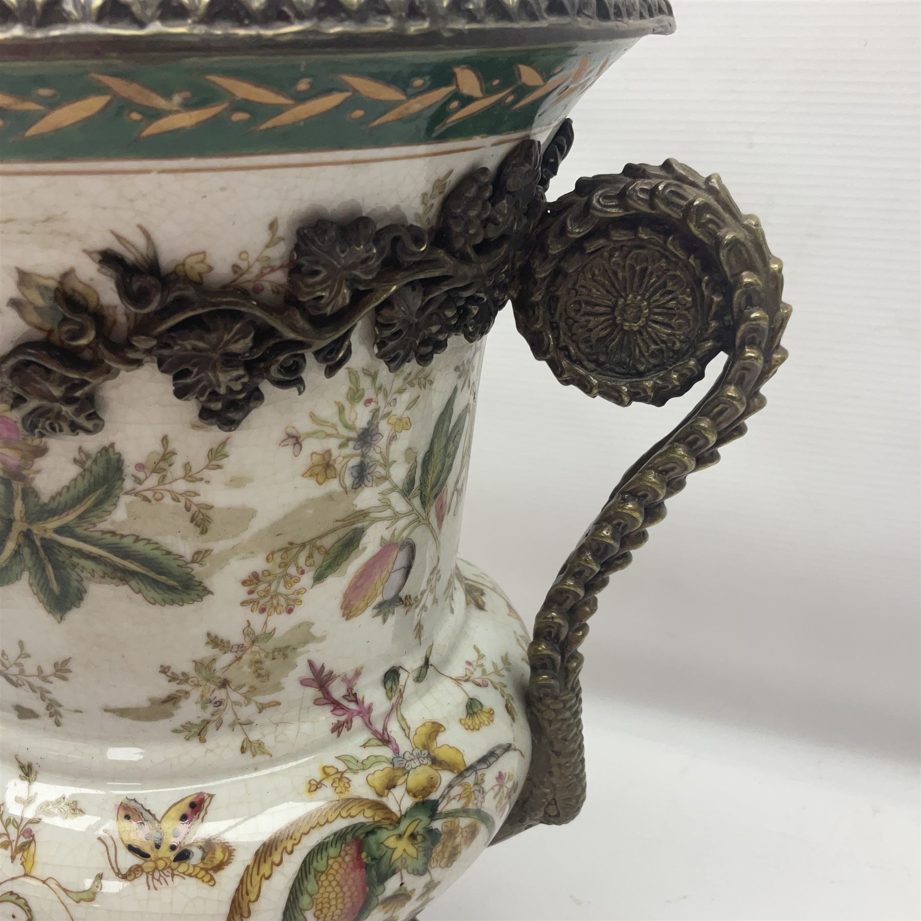 Wong Lee, twin handled ceramic urn with enamelled floral decoration and bronzed metal mounts, marked to base, height 33cm