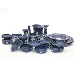 Wedgwood dark blue Jasperware, including candlestick, vases, trinket tray, covered trinket boxes etc 