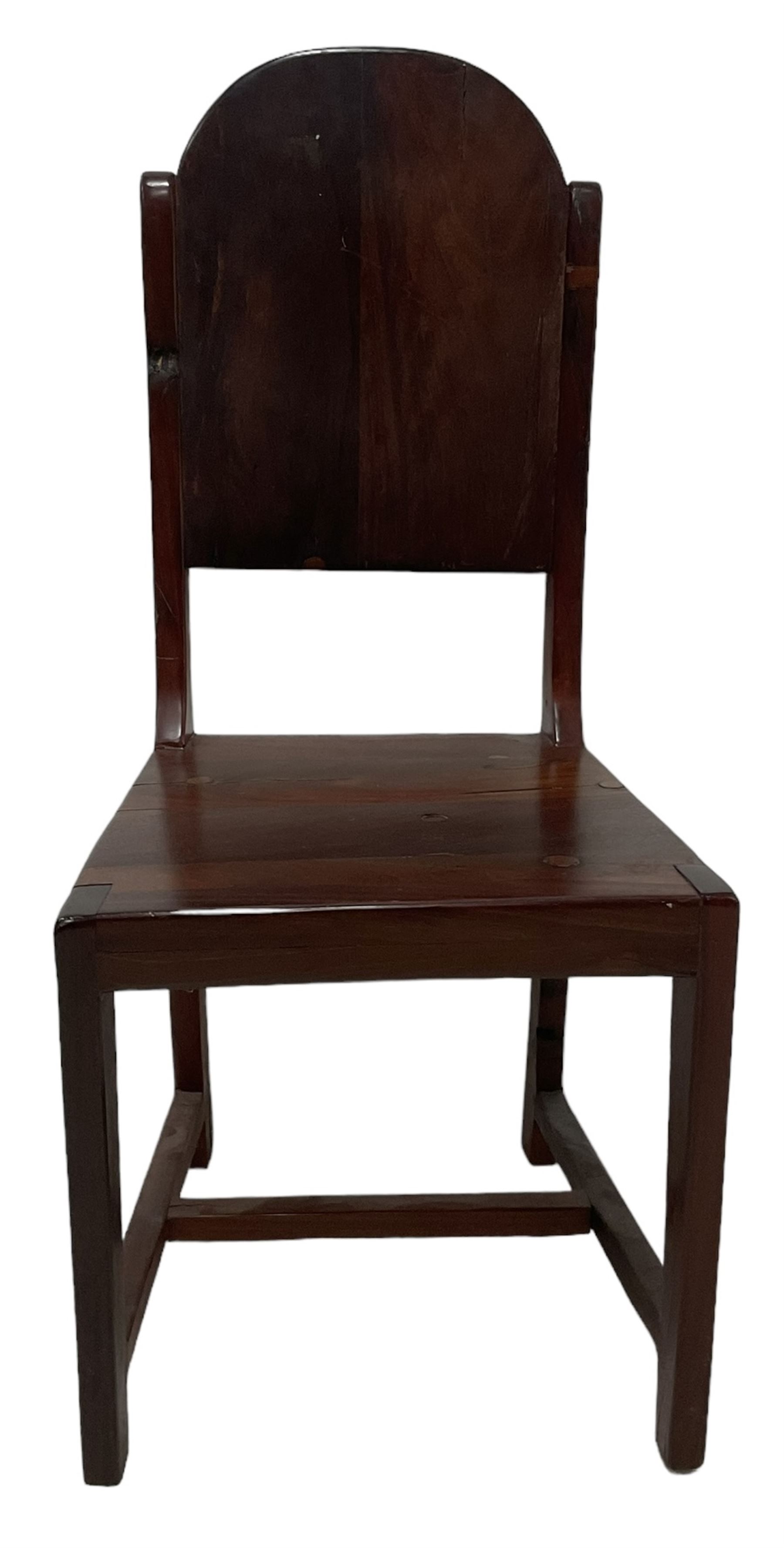 Mid-to-late 20th century teak dining table, rectangular top with canted corners, on square tapering supports with spade feet (214cm x 119cm, H76cm); and a set of eight Burmese reclaimed teak dining chairs, high arched back over panelled seat