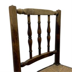 Set of four 19th century elm spindle back chairs, bar cresting rail over three turned vertical spindles, rush seat on turned supports united by turned stretchers 