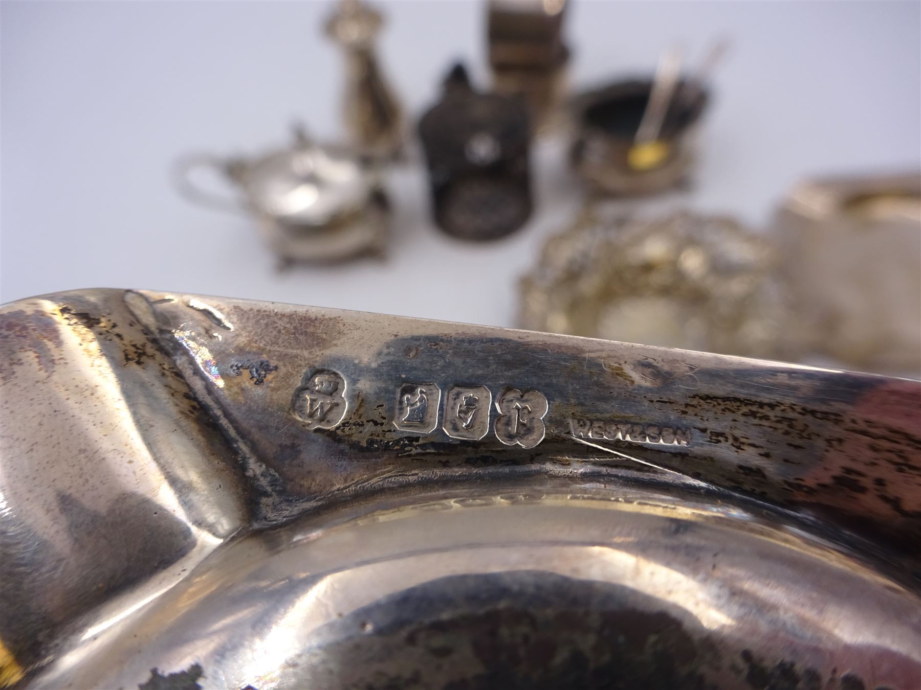 Group of silver, including silver handled button hook, cruet items, two ashtrays and two bon bon dishes, etc, all hallmarked 