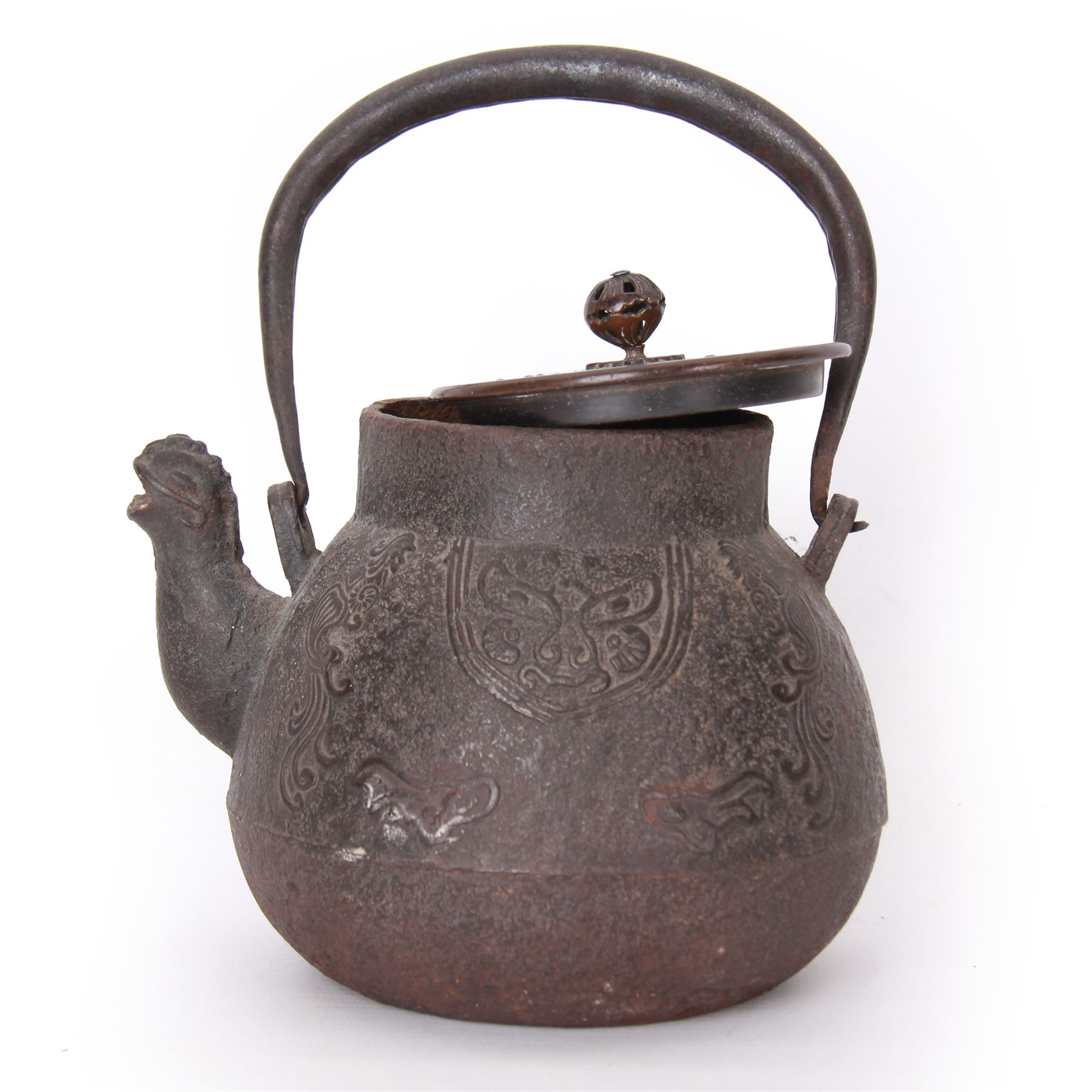 Chinese cast iron teapot, of bulbous form with ring handle, zoomorphic spout and low relief stylised decoration to body, not including handle H14cm