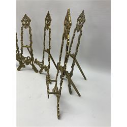 Set of six ornate cast brass easel stands, H30cm