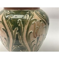 Moorcroft Macintyre Burslem jug, circa 1902, decorated with a motif of stylised flowers amongst scrolling foliage, in shades of brown and green on a peach ground, with printed mark beneath, H16cm