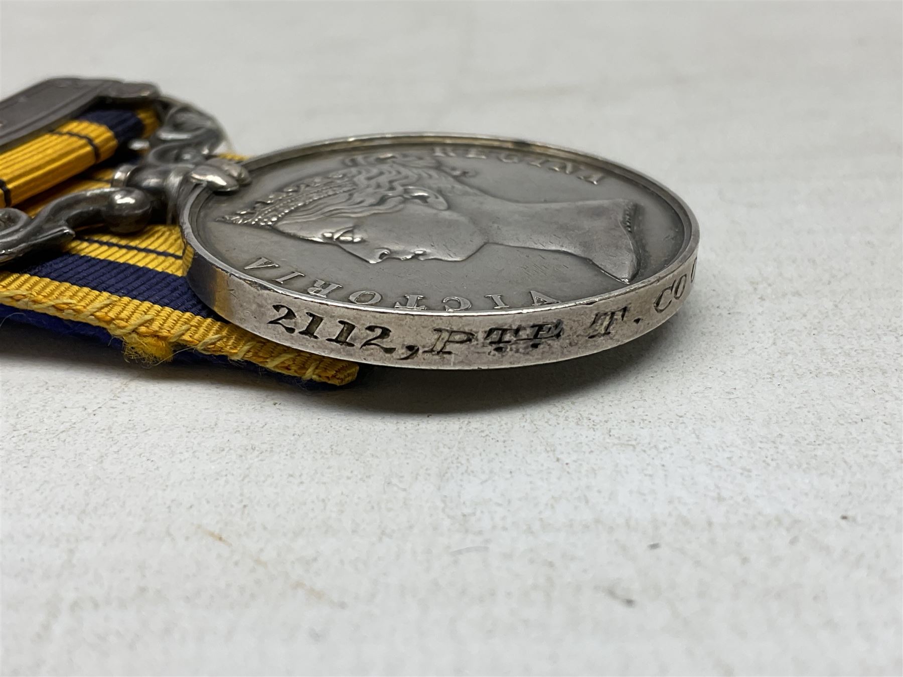 Victoria South Africa (Zulu) Medal with clasp for 1879, awarded to 2112 Pte. T. Cook 1st Dgn. Gds. with card stiffened ribbon