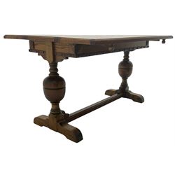 Early 20th century oak 'Ee-zi-Way one motion extending dining table', rectangular top over twin baluster end supports united by stretcher