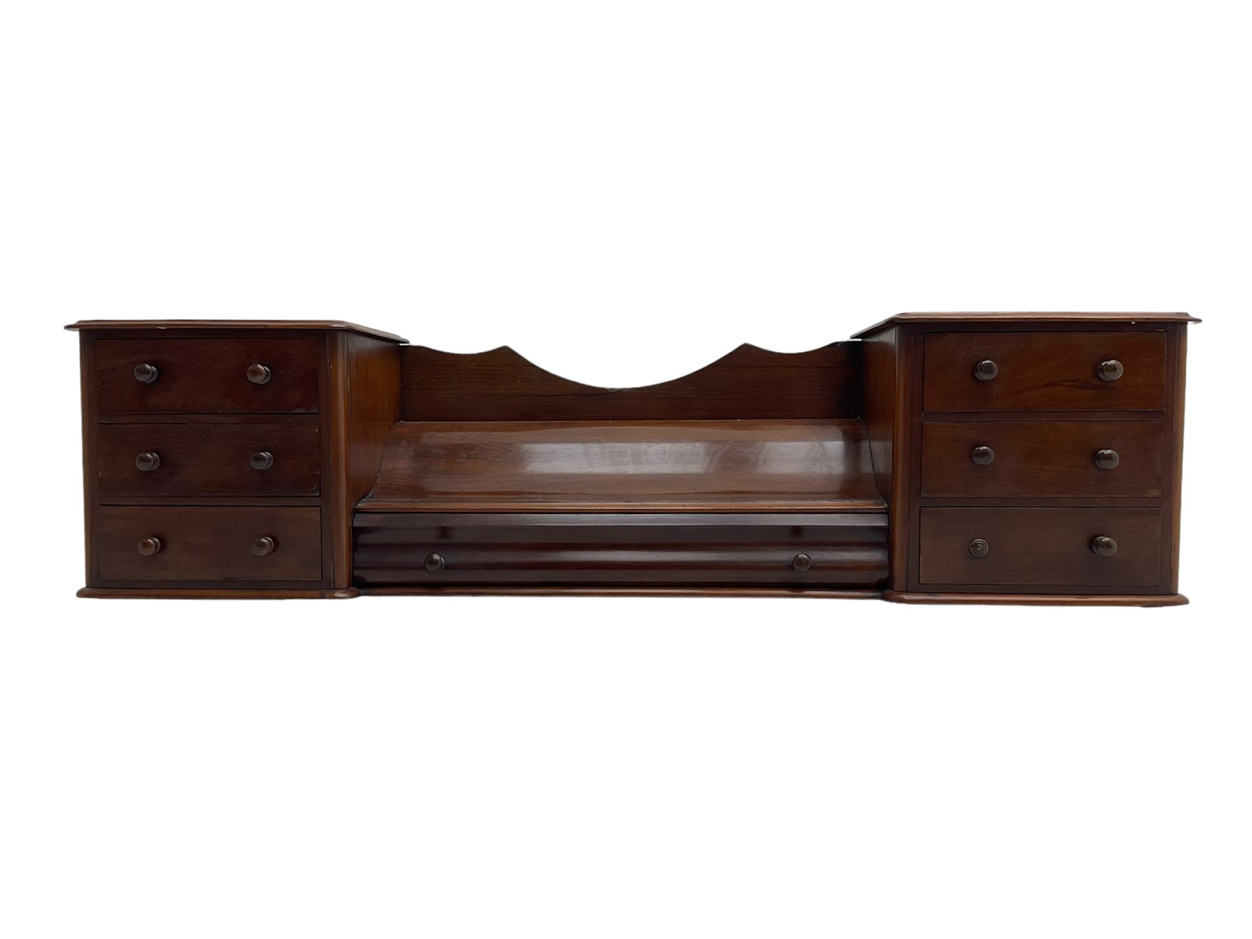 Victorian mahogany correspondence or trinket stand, two banks of three small drawers flanking long central drawer