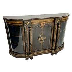 Victorian ebonised and inlaid credenza, break-front with curved ends, the front fitted with two curved glazed doors and central panelled door, inlaid with scrolling foliate and star motifs, quadruple turned and fluted pilasters to front, gilt egg and dart moulded edge on plinth base with figured walnut band, on turned feet