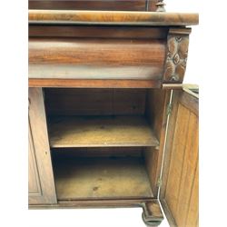 Victorian mahogany chiffonier, raised shaped pediment carved with scrolled extending foliage, two graduating shelves on turned supports, rectangular top over drawer and double cupboard, turned column pilasters, on turned feet 