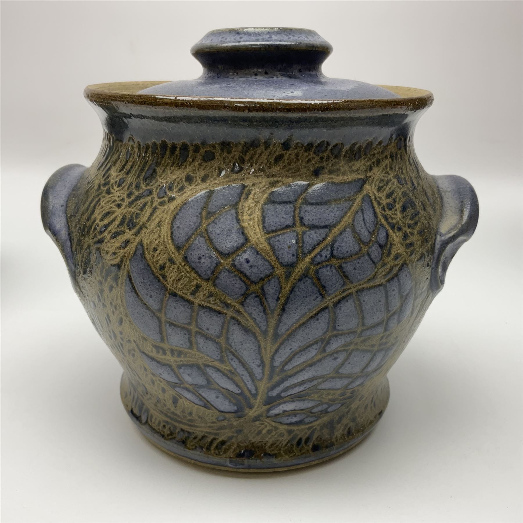 John Egerton (c1945-): studio pottery stoneware, comprising wine cooler decorated with herons on a mottled ground, covered storage jar with foliage decoration and a lamp base decorated with grape vines, wine cooler H23cm