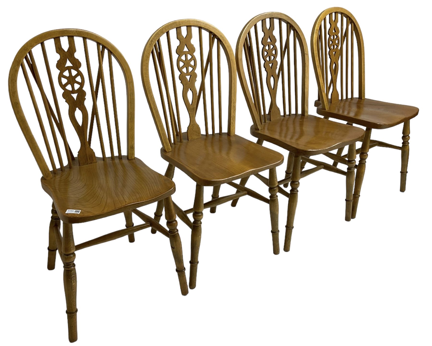 Set of four elm and beech wheelback dining chairs