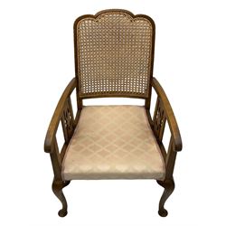 Early 20th century beech framed chair, with scalloped caned backrest, curved arms with pierced splats, upholstered seat in light pink fabric with gold trim, on cabriole supports